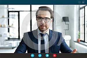 Businessman talking with client by video call, computer screen view