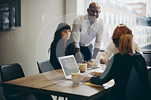 Businessman talking with coworkers in an office