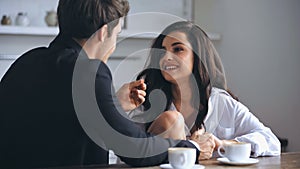 businessman talking with happy girlfriend in