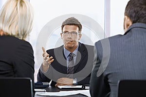 Businessman talking at meeting