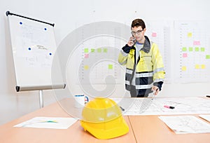Businessman Talking On Mobile Phone At Office Table