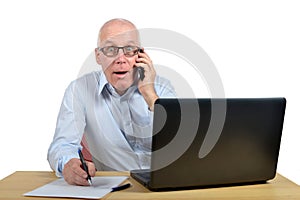 A businessman talking phone and is astonished