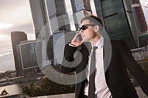 Businessman talking on the phone background of