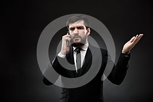 Businessman talking on the phone, gesturing