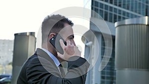 Businessman Talking on Phone Outside Office