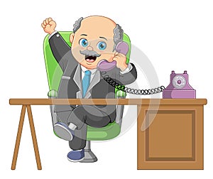 Businessman talking on a retro wired telephone