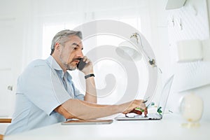 Businessman talking on smartphone