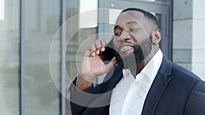 Businessman talking on smartphone at street. Business man calling on phone