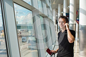 Businessman talking on smartphone walking inside