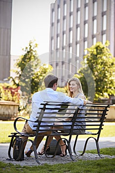 Businessman Talking To Female Colleague On Break In Park