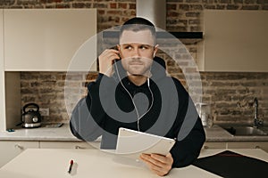 A businessman talking to his colleagues about a business by a video conference