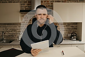 A businessman talking to his colleagues about a business by a video conference