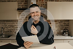 A businessman talking to his colleagues about a business by a video conference