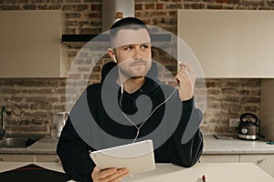 A businessman talking to his colleagues about a business by a video conference