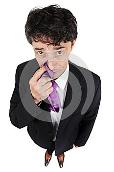 Businessman tapping the side of his nose