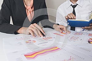 Businessman or Team discussing the charts and graphs showing the results of their successful teamwork.Financial reports are set of