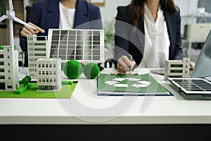 Businessman team using computer on CO2 emission reduction concept with global warming icon. along with climate, energy,