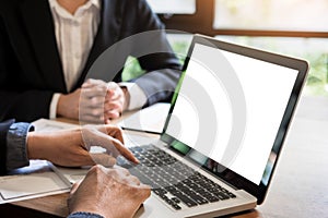 Businessman team working at office desk and using a digital comp