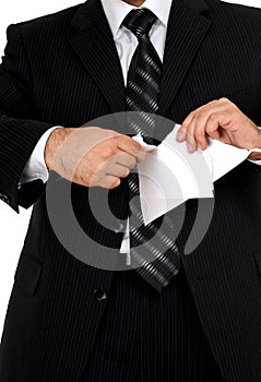 Businessman tear paper