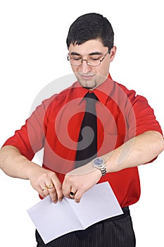 Businessman tear to pieces sheets of paper