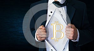 Businessman tearing his shirt and showing bitcoin currency.