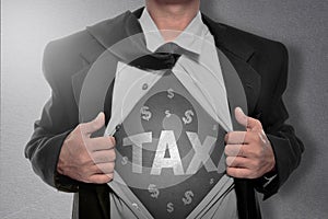 Businessman tearing off his shirt and showing Tax sign