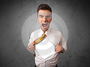 Businessman tearing off his shirt with white copyspace on chest