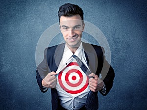 Businessman tearing shirt with target sign on his chest