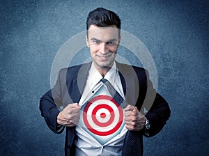 Businessman tearing shirt with target sign on his chest