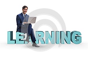 The businessman in telelearning concept with laptop
