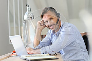 Businessman teleworking with headset