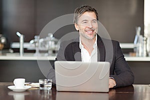 Businessman teleworking at home smiling at the children photo