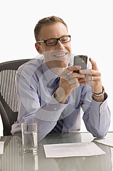 Businessman Texting on Cell Phone - Isolated