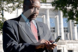 Businessman Texting Outdoors