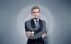 Businessman with thermometer and copy space