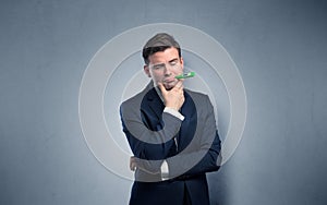 Businessman with thermometer and copy space