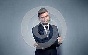 Businessman with thermometer and copy space