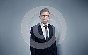 Businessman with thermometer and copy space