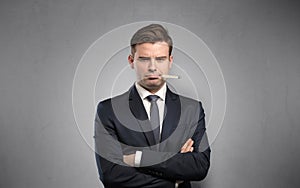 Businessman with thermometer and copy space