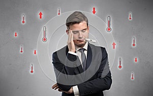 Businessman with thermometer and fever concept