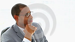 Businessman thinking at his desk