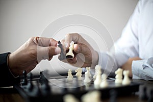 Businessman thinking how to play chess concept business strategy