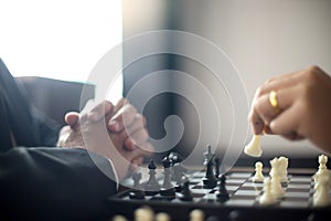 Businessman thinking how to play chess concept business strategy