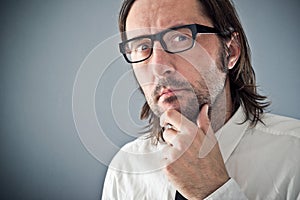 Businessman thinking, portrait with copy space photo