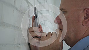 Businessman Thinking Reading a Message on Mobile Phone