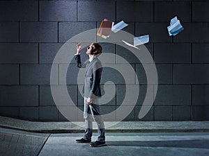 Businessman throwing away files and documents photo