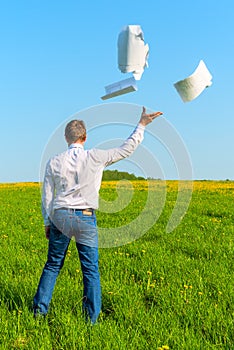 Businessman throwing documents