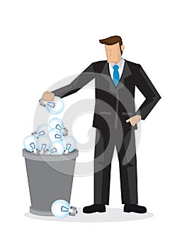 Businessman throwing a light bulb into the trash bin. Concept of innovation or rejected ideas