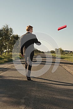 Businessman throws red file
