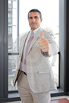 Businessman with thumbs up in outdoor